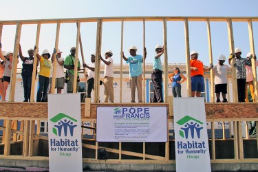 A wall raising during the Pope Francis Home Challenge
