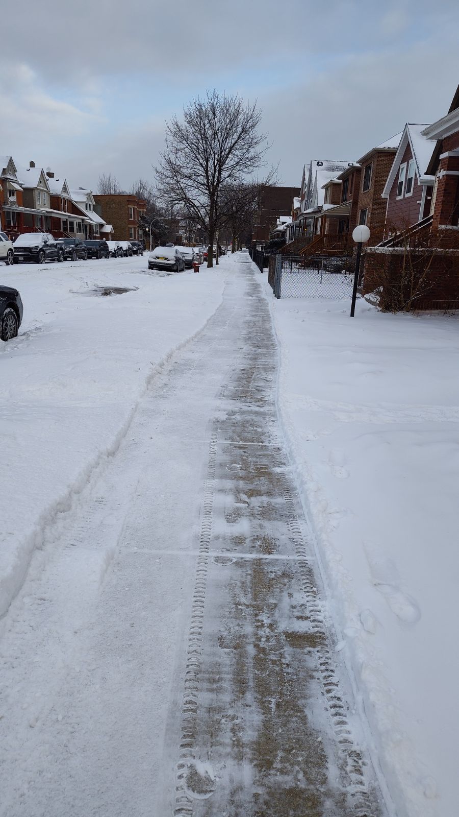 Snow plowed on sidewalk